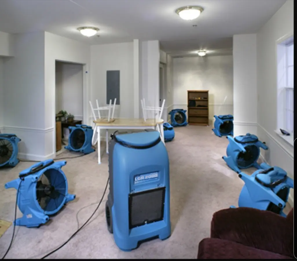 Air movers and dehumidifier setup for Water Damage Restoration in Forest City
